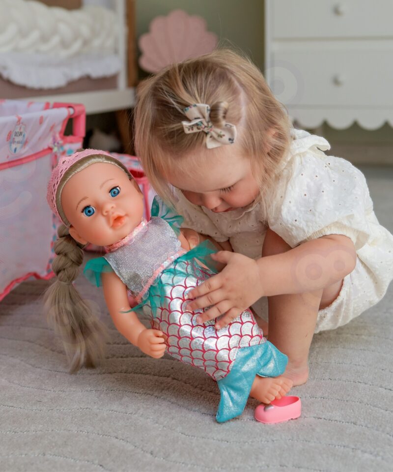 Kokkupandav roosa vanker merineitsi motiiviga