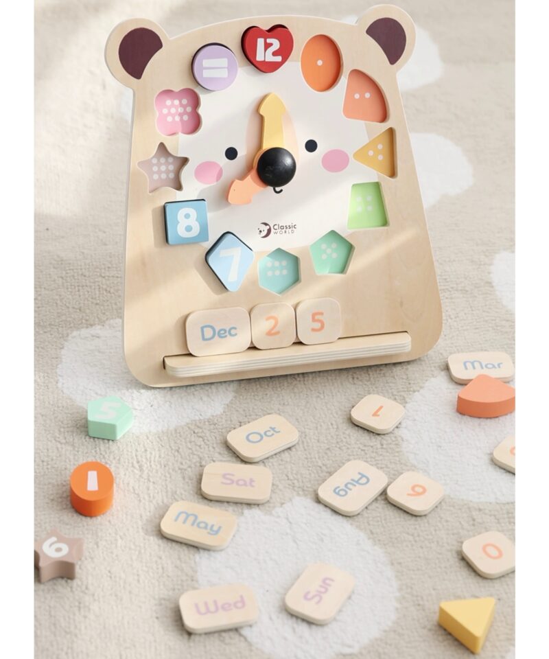 Karukujundusega puidust mängukell