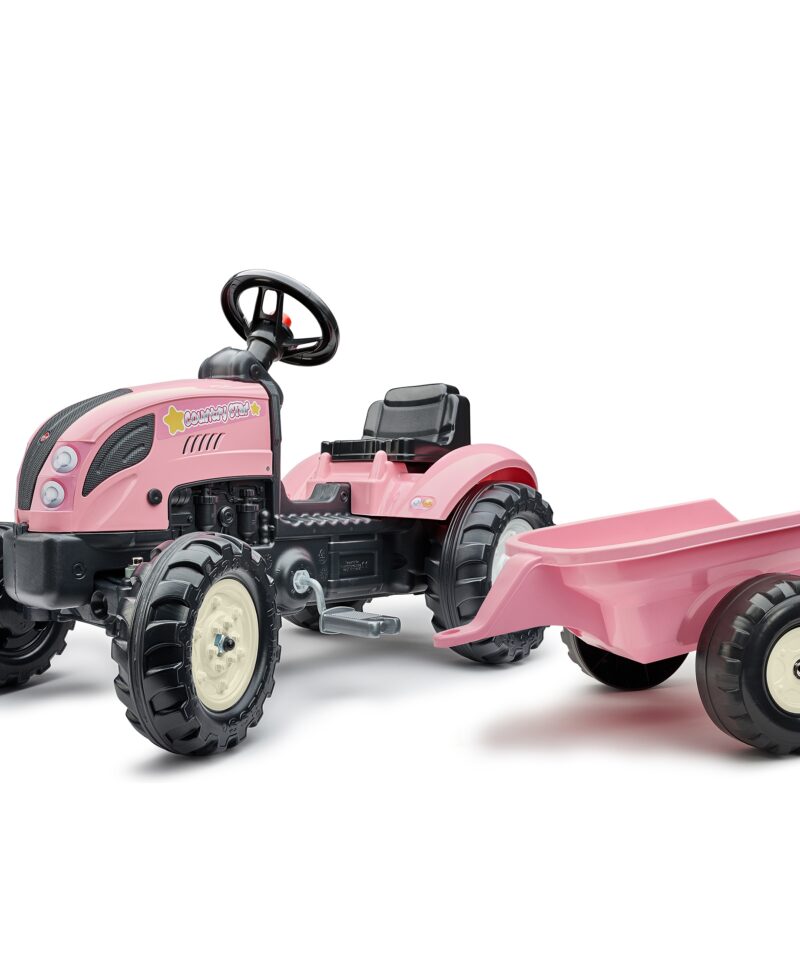 Roosa pedaaltraktor koos järelkäruga murul