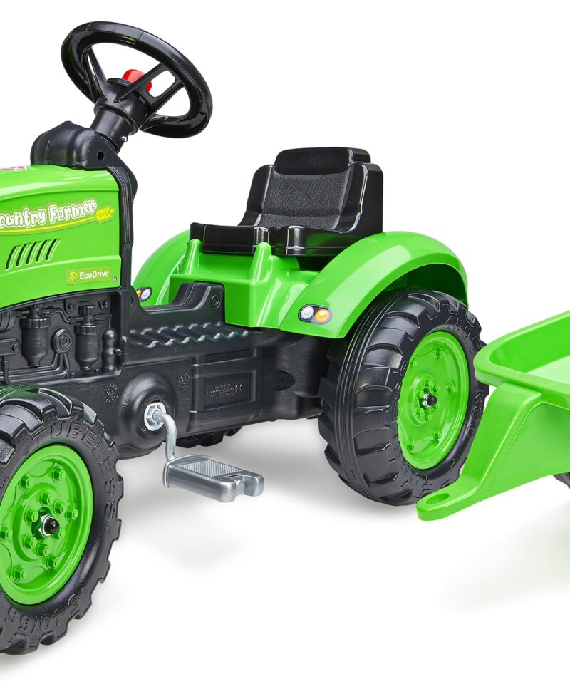 Laste pedaaltraktor haagisega rohelisel murul